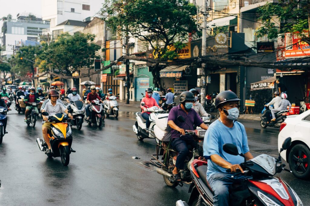 people riding motorcycle on road