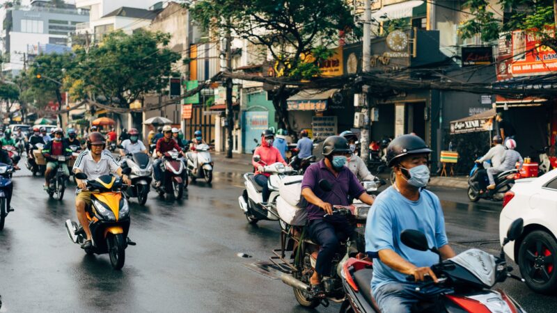 people riding motorcycle on road