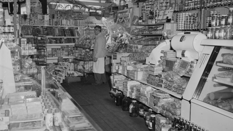grayscale photo of people in market