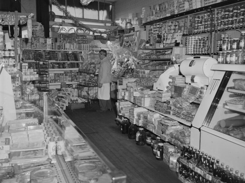 grayscale photo of people in market