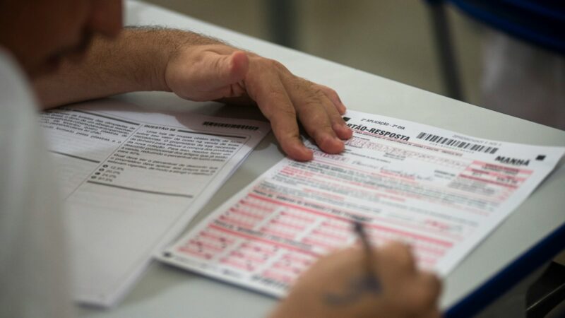 person filling on application form