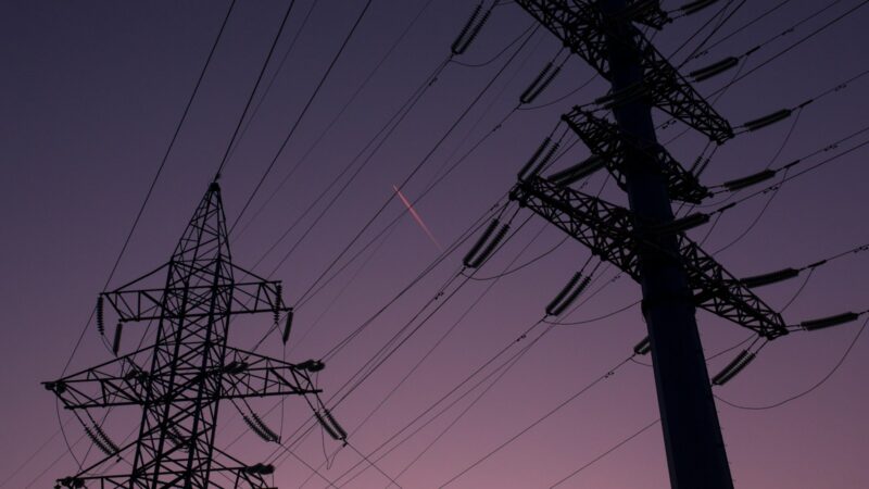 silhouette of electric towers