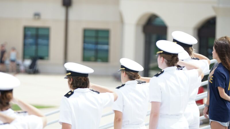 five person wearing white suits